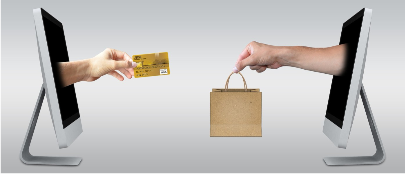 hands coming out of computer with credit card and shopping bag